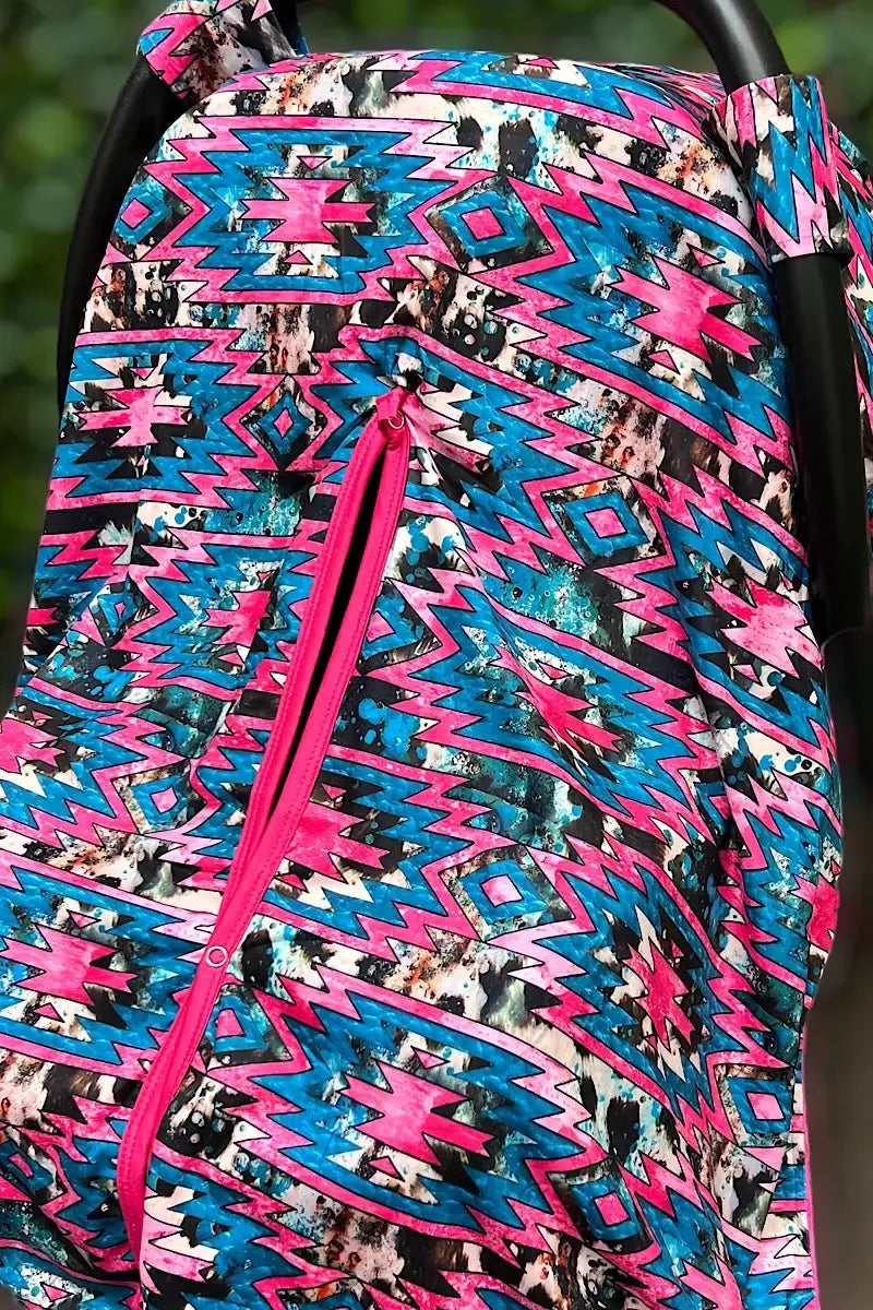 AZTEC PRINTED CARSEAT COVER W/ORANGE SOFT FABRIC.