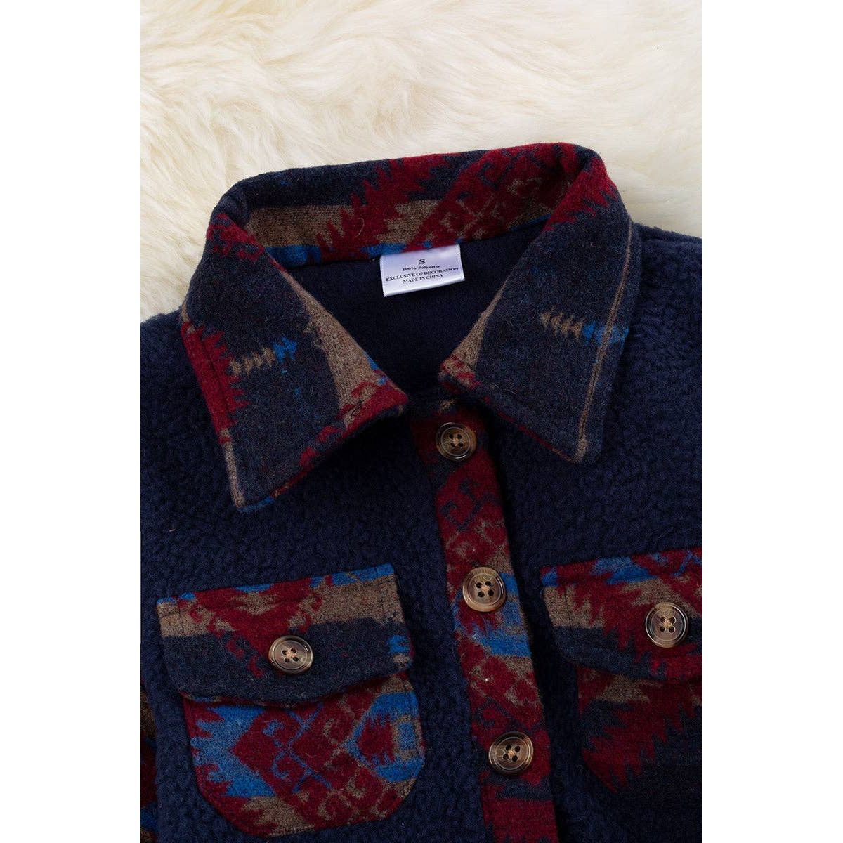 Navy blue sherpa shacket with geometric printed sleeve. TPG65133050SOL